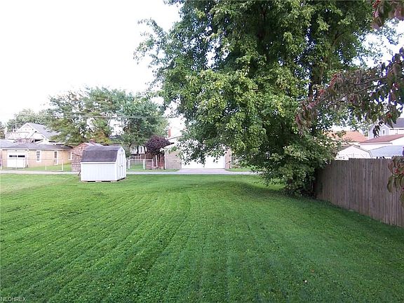 Back Yard with Storage Building and Alley Access