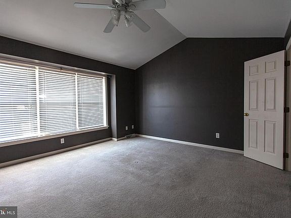 MASTER BEDROOM WITH CATHEDRAL CEILING AND FAN