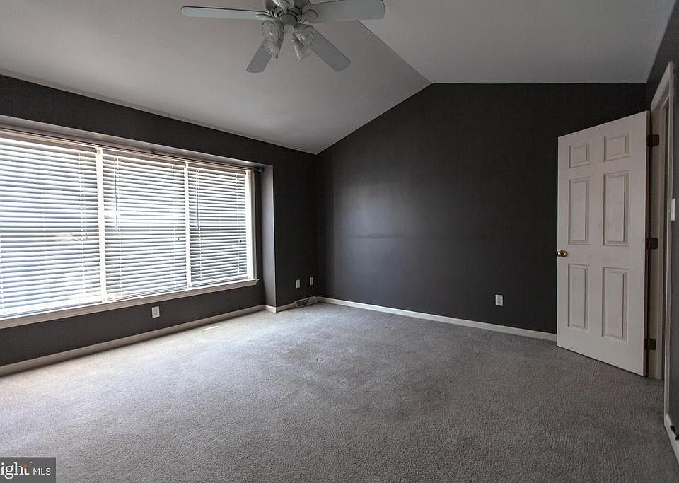 MASTER BEDROOM WITH CATHEDRAL CEILING AND FAN