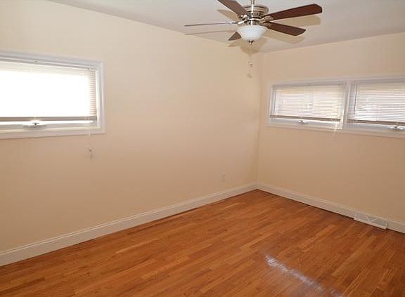 Master bedroom has ceiling fan & refinished floors