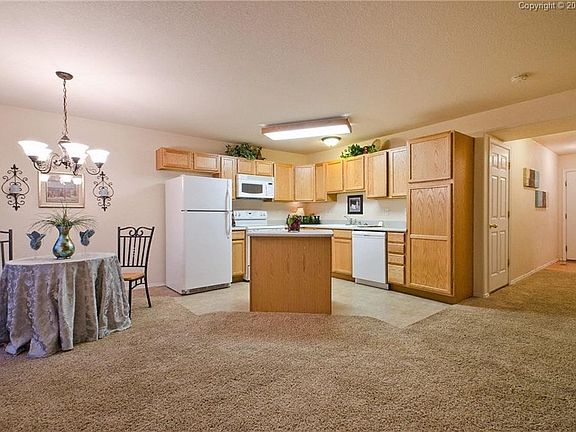 The Dining Area is convenient off the Kitchen w/an attractive light fixture and 