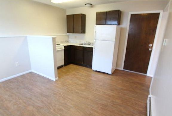 Kitchen Living Room - Door on right is to go upstairs, outside.