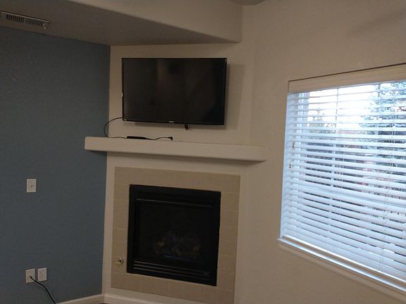 Gas fireplace and TV (it stays)