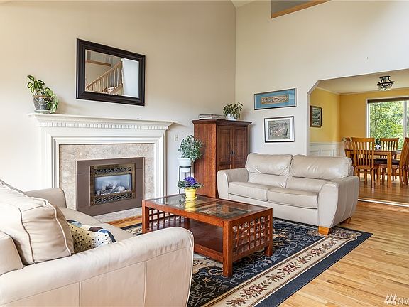 From your living room view of the dining area and backyard garden.