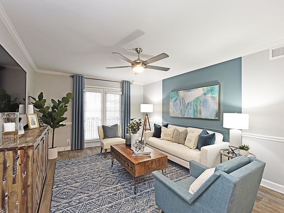 Spacious living room with hardwood-style flooring