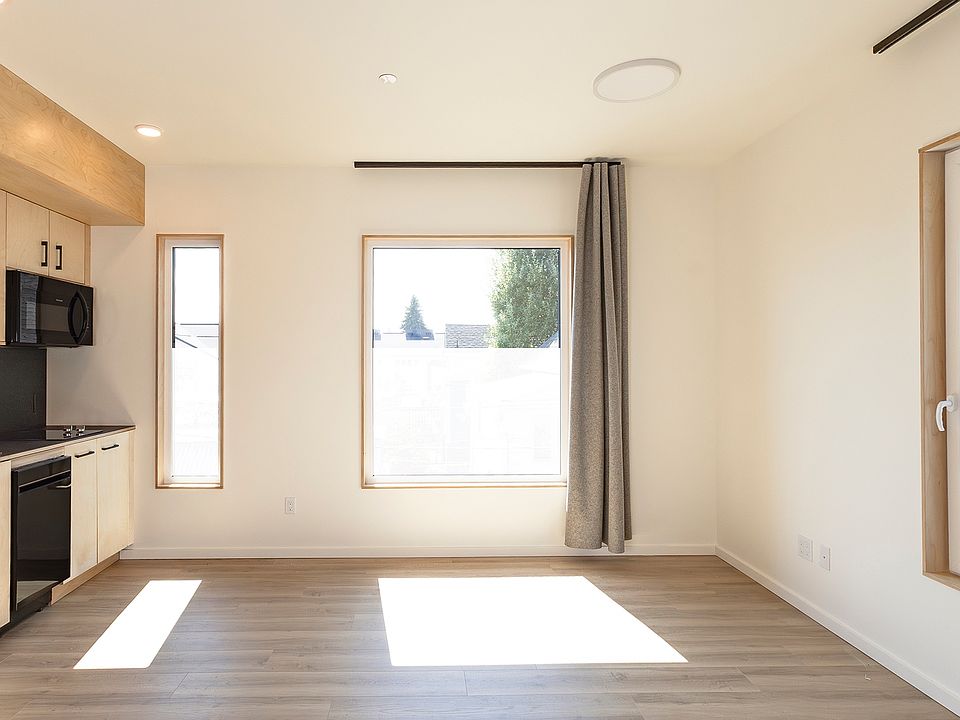 south and west facing windows bring loads of natural light into this corner studio