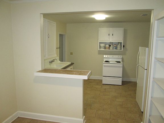 Spacious eat-in kitchen with ceramic tile floor.