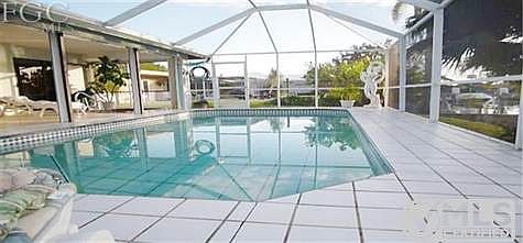 Full tiled patio and tiled pool