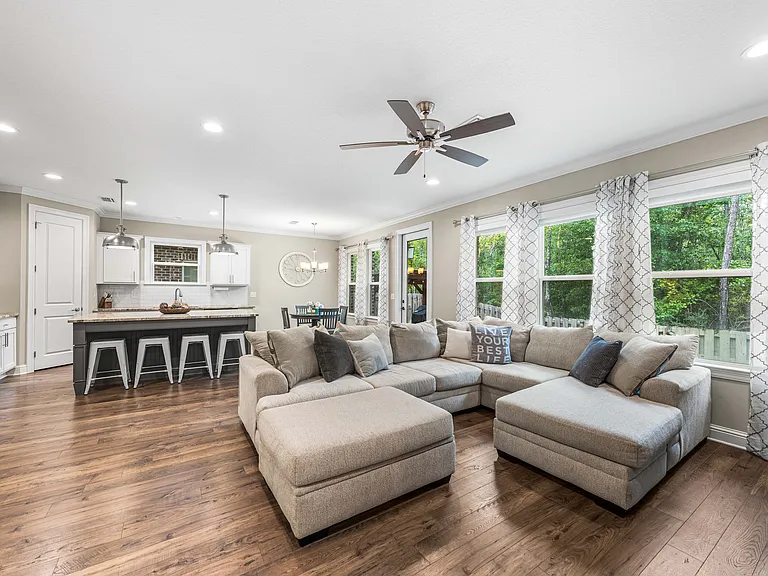 Open concept main living (with previous furniture)