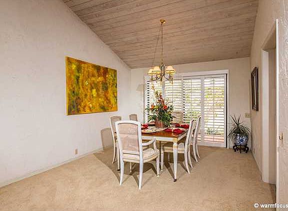Dining room adjacent to the kitchen with views of the patios