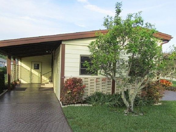 car port and 2nd driveway
