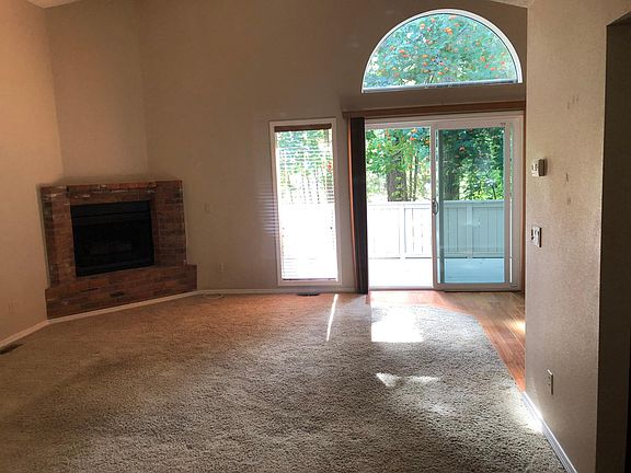 Living room, gas fireplace, sliding door to deck