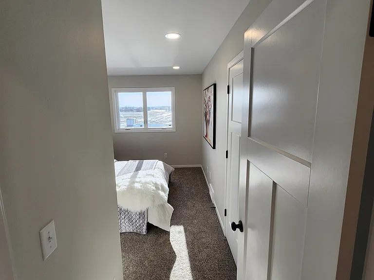 Bedroom two. (Pictures are of another unit with similar finishes and features.)