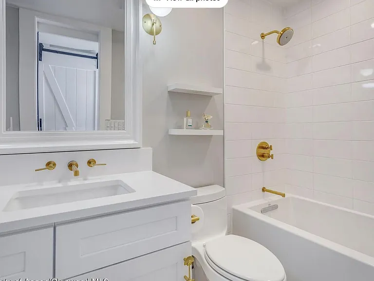 mirror has been replaced with a medicine cabinet mirror for additional storage