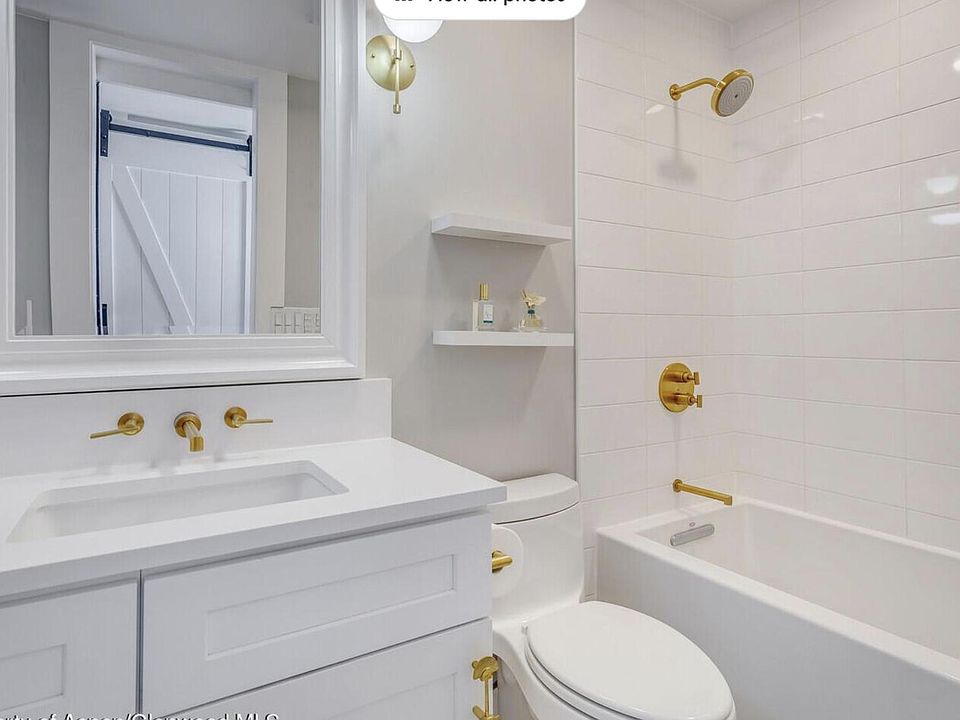 mirror has been replaced with a medicine cabinet mirror for additional storage