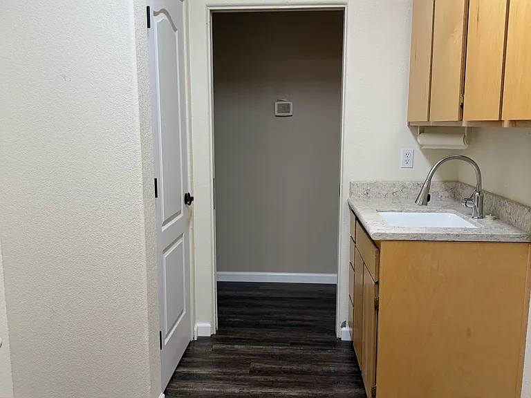 Laundry room with storage, sink, and washer and dryer hookups