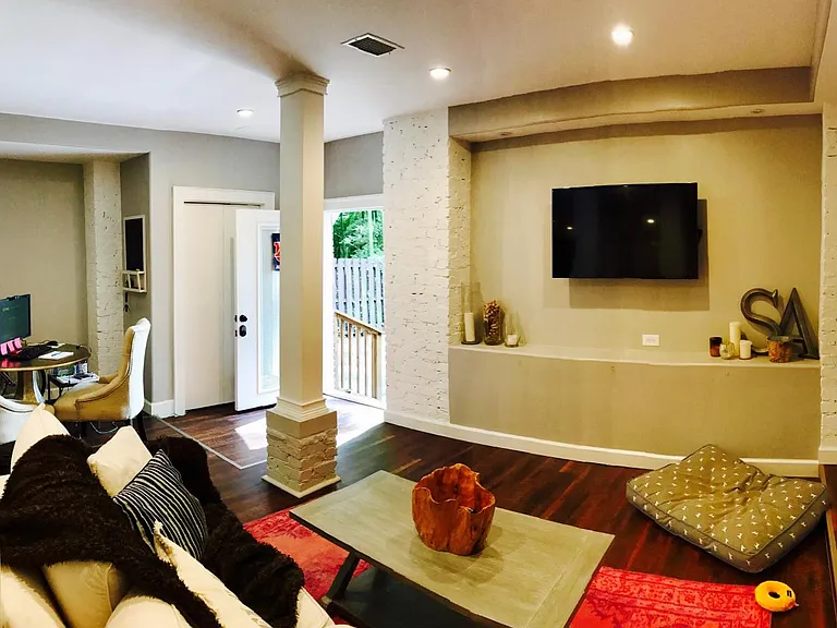 Living room with glass-paned front door (with built-in blind