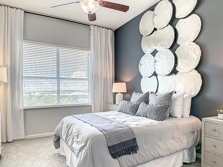 Enjoy cozy bedroom havens with large windows, plush carpeting, and lofty ceilings fostering an airy and serene ambiance, ideal for luxe relaxation.
