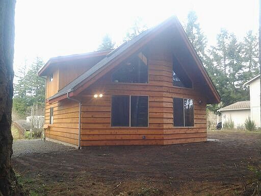 The back of home facing a green belt
