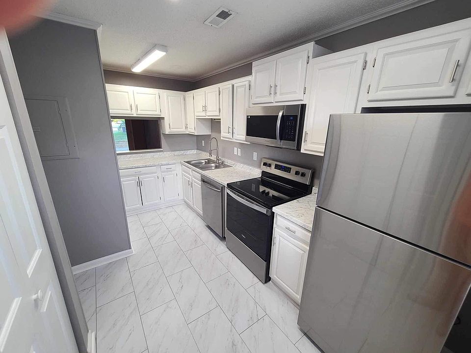 Spacious kitchen, ALL NEW! Updated and refreshed in every way with new appliances, flooring, plumbing fixtures, paint, flooring and refreshed cabinetry and hardware.