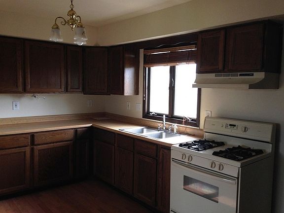 Kitchen with Refrigerator & gas range and laundry hook-ups i