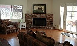 Family room with cozy fireplace.