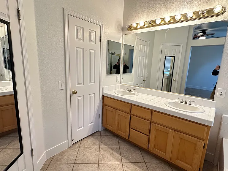 Master bathroom with walking closet and separate toilet with door