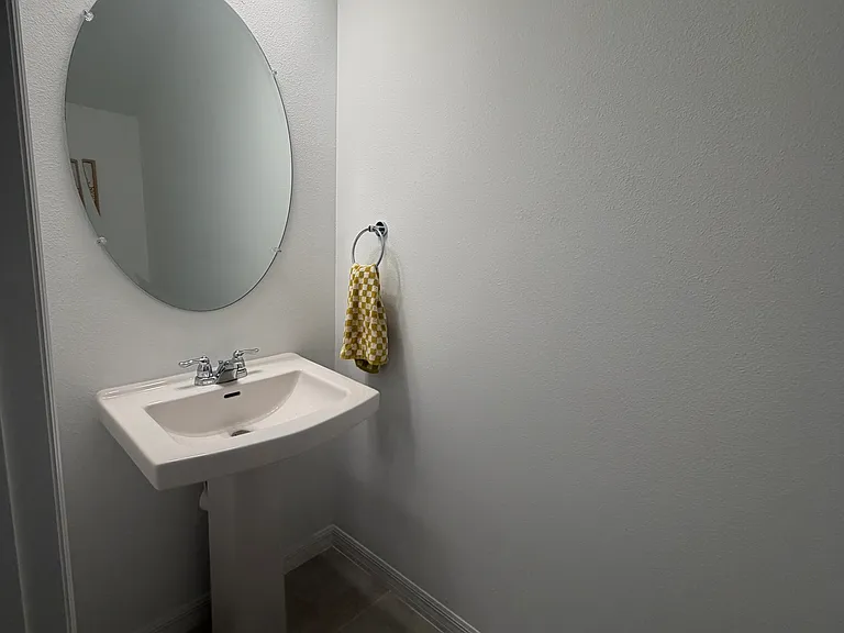 Under stairs powder room.