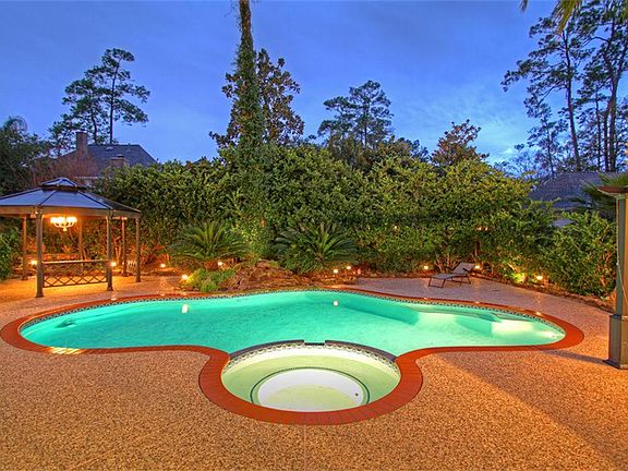 Evening Photo Of Pool/Spa/Waterfall Showing Some Of the Backyard and Gazebos