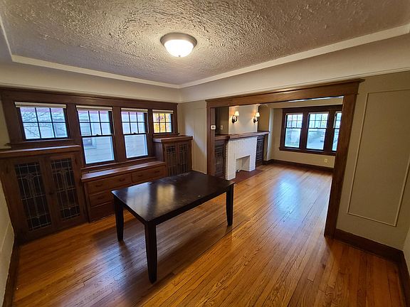 More built-in, leaded glass cabinets in the dinning room.