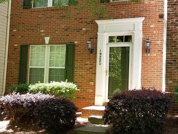 All brick townhome, shaded street