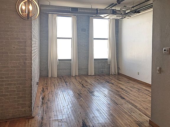 Large double 7 foot windows adorn 11 foot ceilings