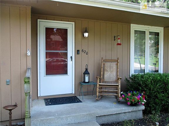 The front porch is wide enough for seating.