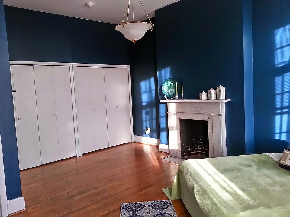 Large bedroom with wall of storage
