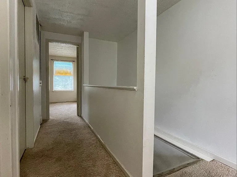 Second floor hallway leading to the master bedroom.