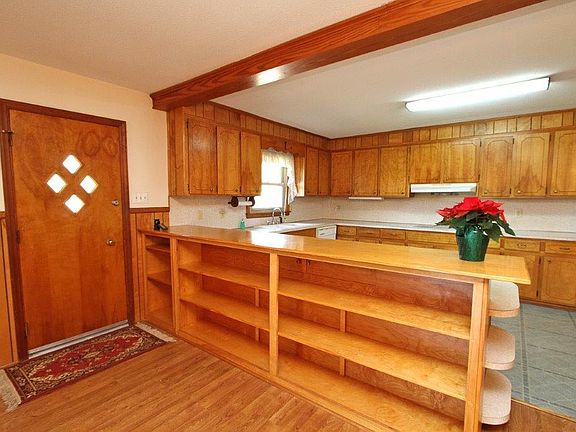 Original built in bookshelves with hidden spaces.