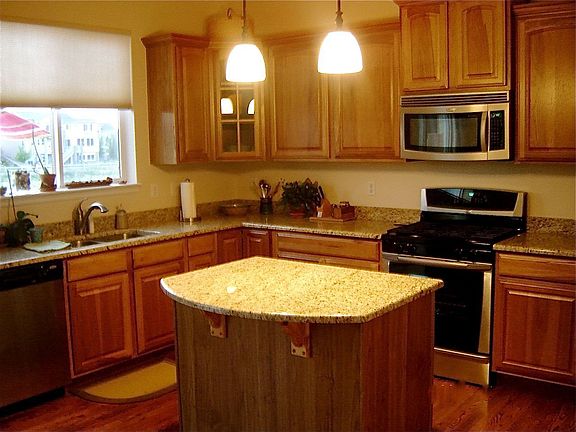 upgraded kitchen w/granite, hardwoods, stainless appl.