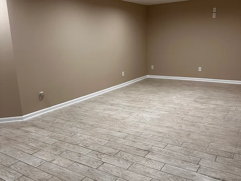 Entertainment area in the basement. Cables TV are hook up on the wall