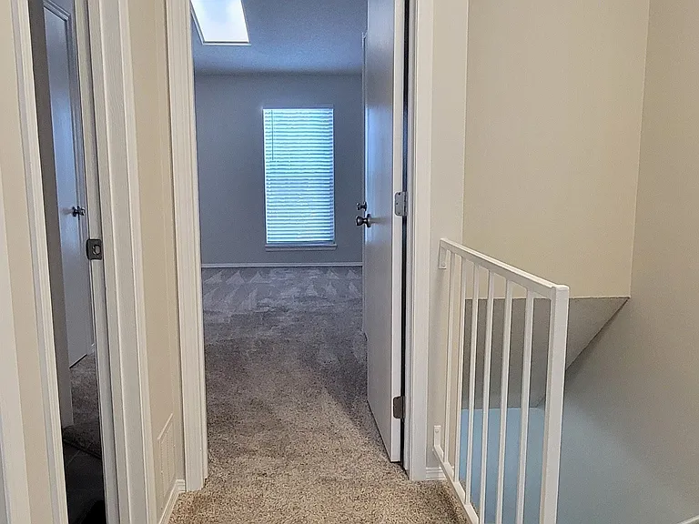 Upstairs hall looking into the master bedroom.