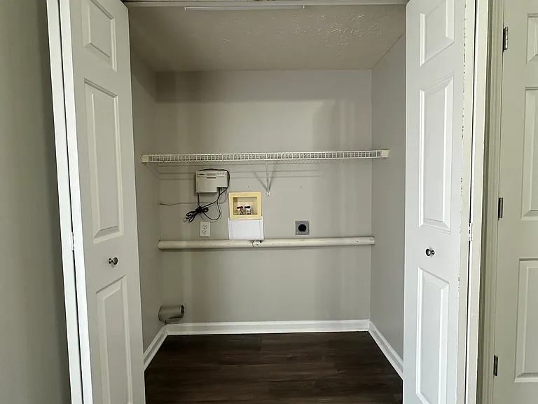 (3-Bedroom 1.5 Bath Unit) washer and dryer hookup off the kitchen.