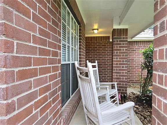 Watch the kids play on this comfortable front porch.