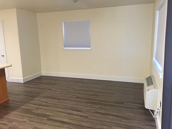 Main floor living/dining area off of kitchen. Main floor is wood-look vinyl plank