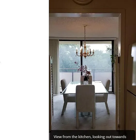 View from dining room to the kitchen with french louvre doors (right) that easily open and close!
