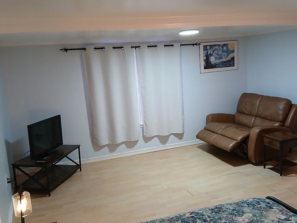 leather electric reclining loveseat and TV