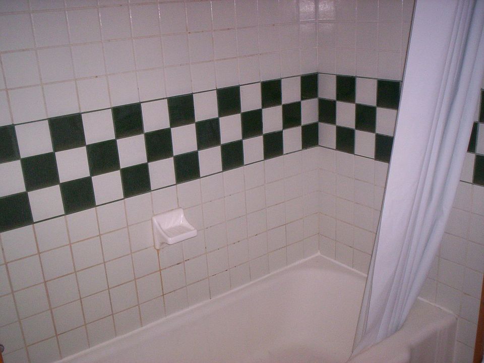 bathroom with shower and tub
