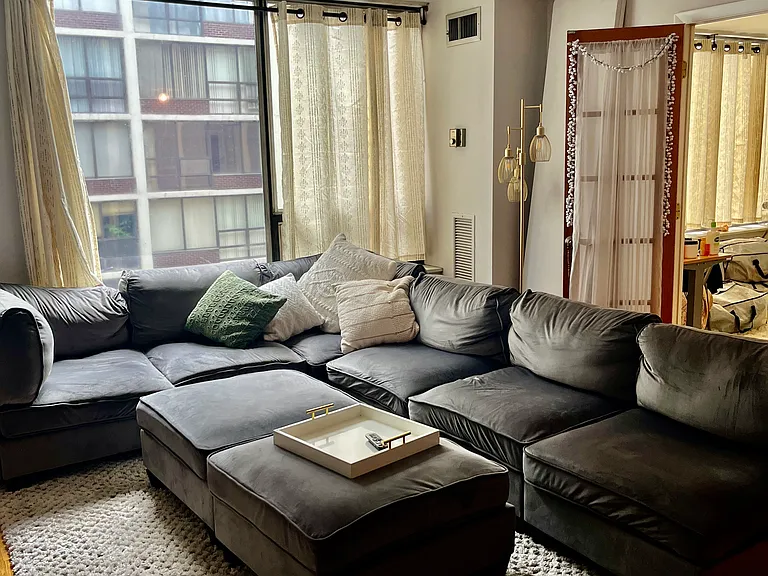 Living room with French doors that open to bedroom