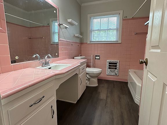 Bathroom #1: traditional bathroom with original tile.