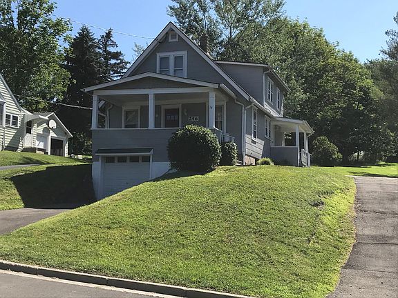 Front of house. Driveway to upstairs on right.