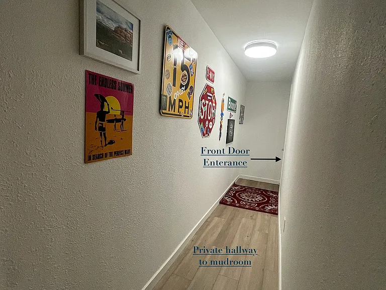 Front door leads to private hallway for unit 9.