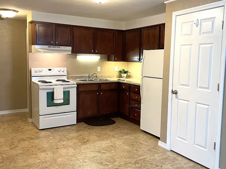 Kitchen, laundry room, hall to bedroom, and bath